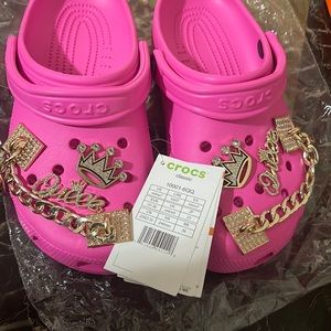 Brand new pink crocs , charms included